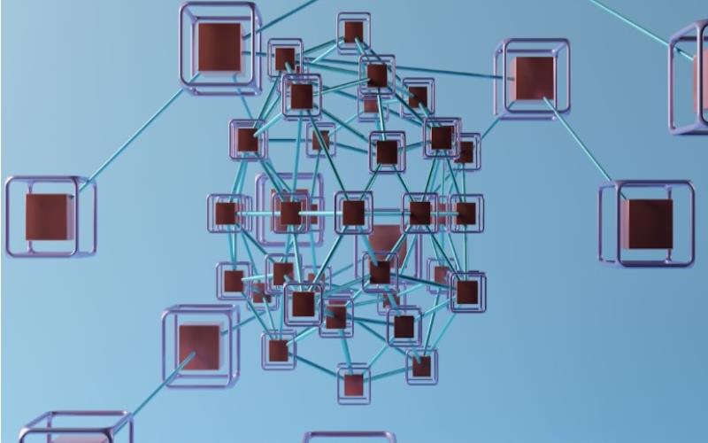 An artistic representation of a node diagram with orange nodes and blue connecting lines.
